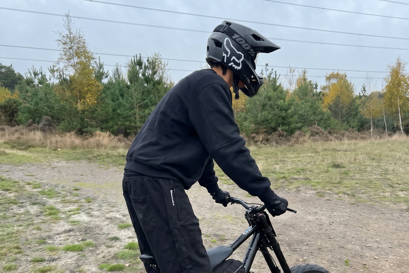 Rider in a Fox helmet on an F1 conversion e-bike